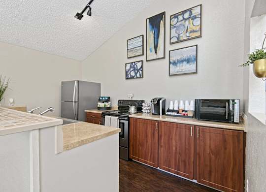 A kitchen with a refrigerator, microwave, and oven. at Brookstone, SeaTac, WA