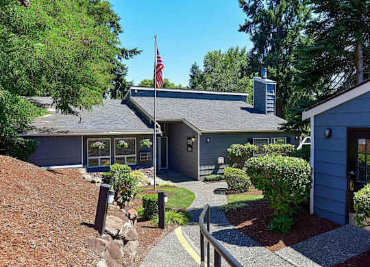 A building with a flag on top of it. at Brookstone, SeaTac, WA, 98198