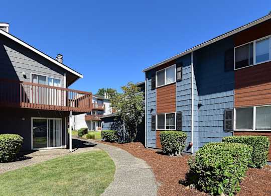 A sunny day at a residential area with two buildings and a pathway. at Brookstone, SeaTac, WA, 98198