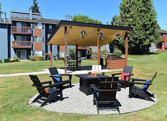A patio with a table and chairs under a canopy. at Brookstone, SeaTac, 98198