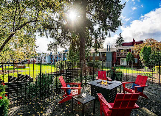 A sunny backyard with a table and chairs. at Brookstone, SeaTac, WA, 98198