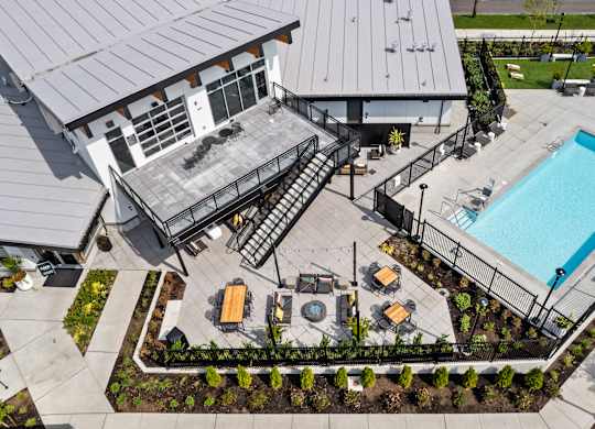 an aerial view of a building with a swimming pool and patio furniture at Gage On Sixth, Washington