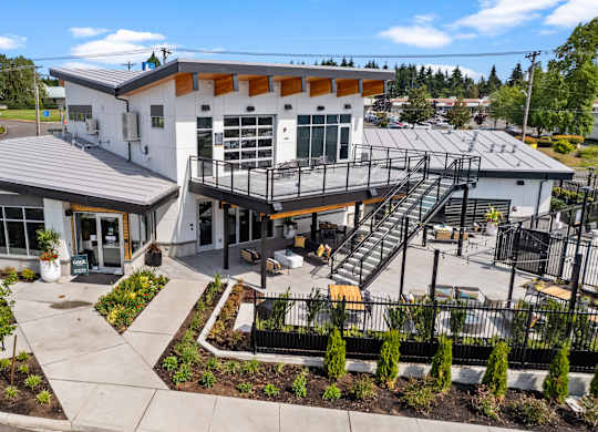 the front of a building with a balcony and a staircase at Gage On Sixth, Tacoma