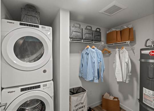 a laundry room with a washing machine and a dryer at Baldwyn, Seattle, WA 98125
