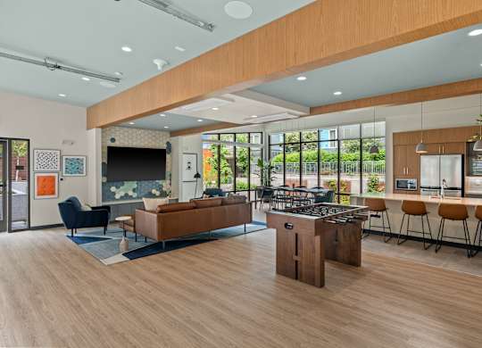 a communal area with a kitchen and a living room with a bar and a table at Baldwyn, Washington, 98125