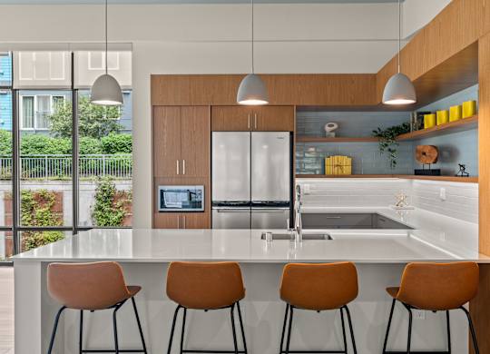 a kitchen with a large island and four chairs at Baldwyn, Seattle