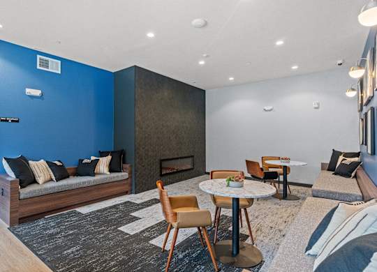 a living room with a blue accent wall and a fireplace at Baldwyn, Washington