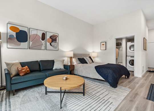 a living room with a couch and a bed