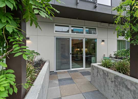 the entrance to a building with glass doors