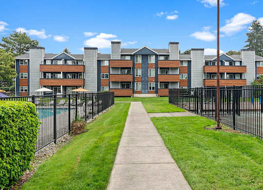 A long building with a fence in front of it. at Northpoint Apartments, Tacoma, WA, 98407