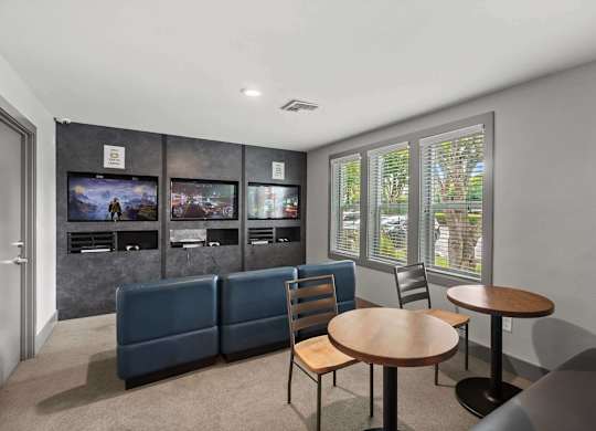 A living room with a couch, chairs, and a television. at Northpoint Apartments, Tacoma, WA, 98407