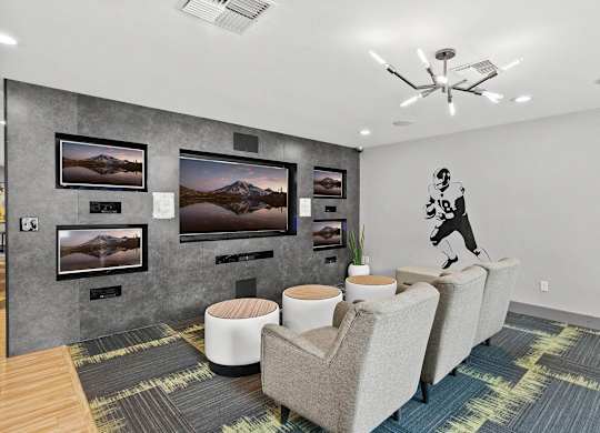 A room with a grey wall and a painting of a mountain. at Northpoint Apartments, Tacoma, Washington