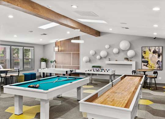 A room with a pool table and air hockey table. at Northpoint Apartments, Washington, 98407