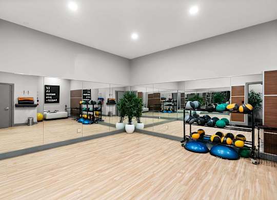 A bowling alley with wooden floors and bowling balls on racks. at Northpoint Apartments, Tacoma, Washington