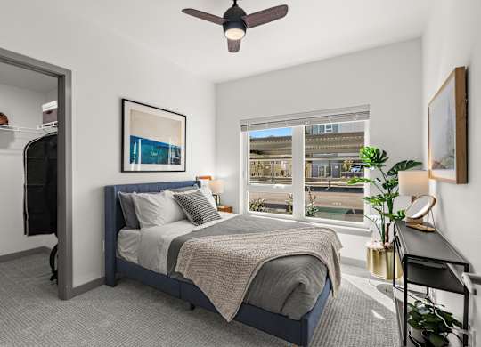 a bedroom with a bed and a ceiling fan at Gage On Sixth, Tacoma, WA 98406