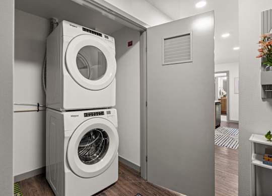 a front loading washer and dryer in a laundry room at Gage On Sixth, Tacoma, WA