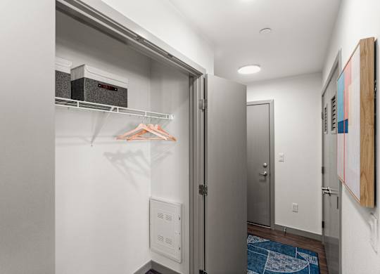 a walk in closet with a refrigerator and a washing machine at Gage On Sixth, Tacoma, 98406