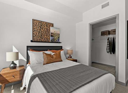 a bedroom with a large bed and a closet at Gage On Sixth, Washington, 98406