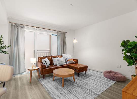 a living room with a couch and a coffee table at Baldwyn, Seattle, WA 98125