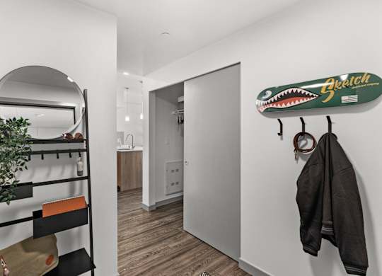 a room with a closet and a surfboard on the wall at Gage On Sixth, Tacoma
