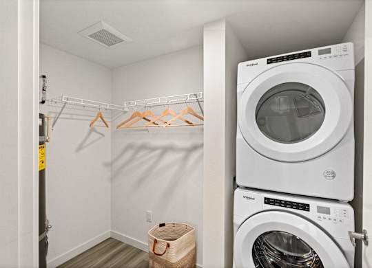 a laundry room with a washing machine and a washer and dryer in it at Baldwyn, Seattle, 98125