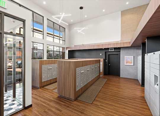 a view of the lobby of a building with wood floors and glass doors at Baldwyn, Washington