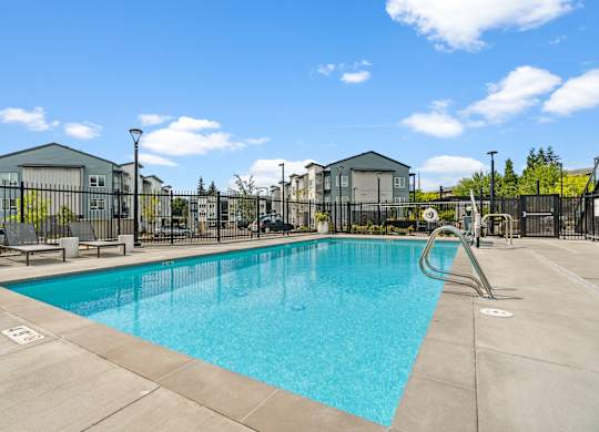 our apartments have a swimming pool with a fence around it at Gage On Sixth, Washington, 98465