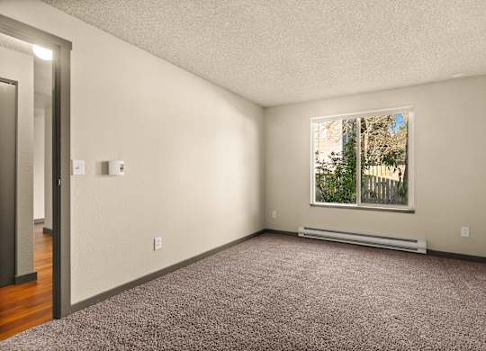 A room with a window and a door.