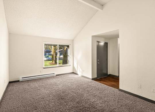 A room with a window and a door.