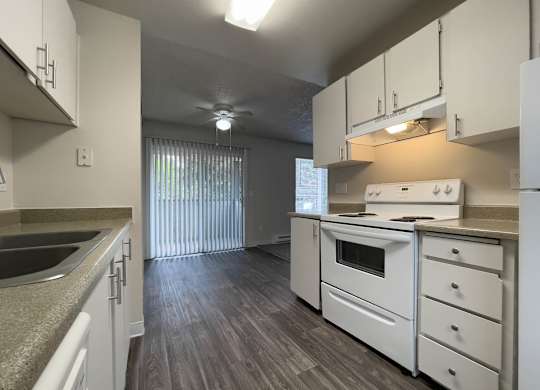 Kitchen with white cabinets at Arbor Pointe, Lakewood, WA