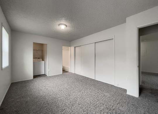Room with attached closet and carpeted floor at Arbor Pointe, Lakewood, WA, 98498