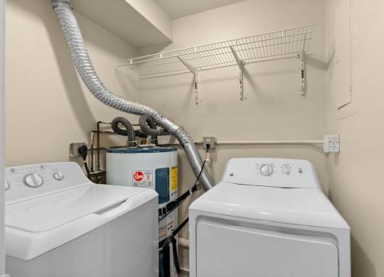 A laundry room with a washer and dryer.