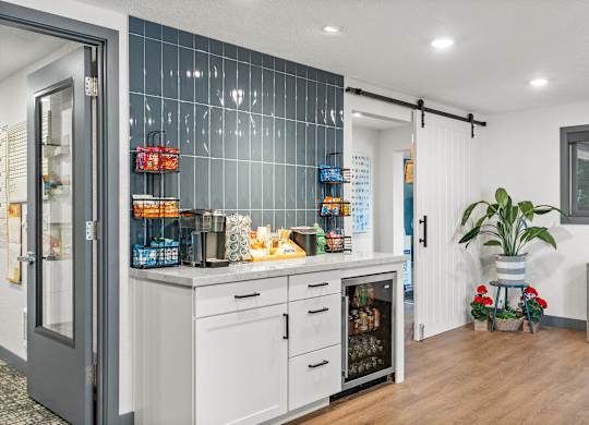 A kitchen with a white fridge and a white oven.