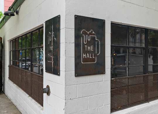 A white building with a sign that says