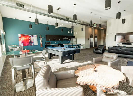A modern living room with a pool table and a television. at The Platform, Kent, 98032