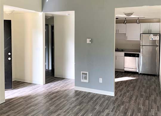 a view of the living room and kitchen from the dining room