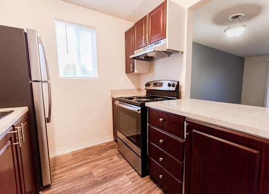 Lakewood Apartments - Bellmary Park Apartments - Kitchen, Living Room, and Deck at Bellamy Park Apartments , Lakewood, 98498