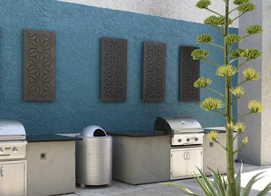 A wall with a blue background has a patterned design on it.