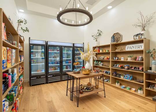 A pantry section in a store with a variety of food items on display.