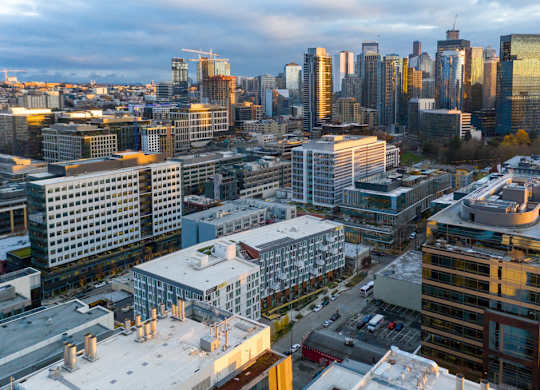 A cityscape with buildings of various heights and architectural styles.