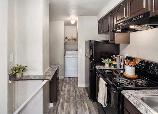 A black stove top oven with a pot on it.