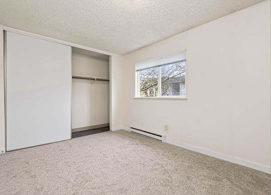 A room with a sliding door and a window. at Brookstone, SeaTac, WA, 98198