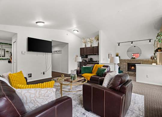 A living room with a fireplace and a couch.
