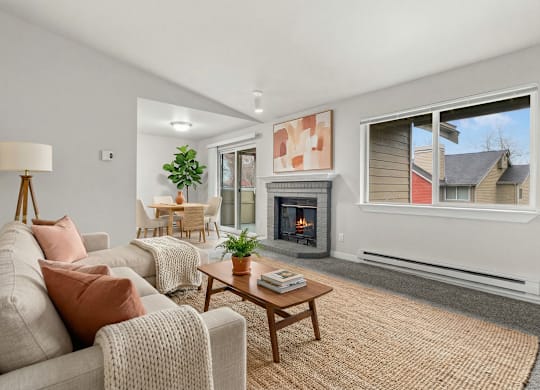 A living room with a fireplace and a couch.