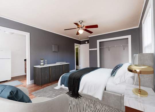 a bedroom with a bed and a ceiling fan at Edwards on Fifth, Seattle, WA, 98121