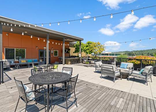 A patio with a table and chairs is set up outside a building.