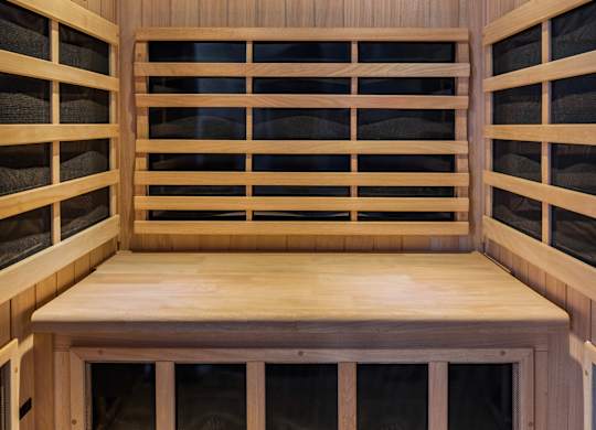 A wooden bench with windows on the sides.