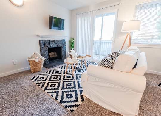 living room with couch and tv at ReVive Apartments, Fife