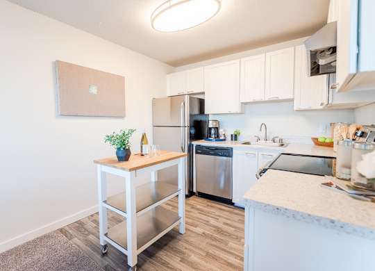 kitchen with white interior at ReVive Apartments, Washington, 98424