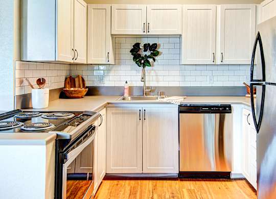 Everett Apartments The Lynx Kitchen with Stainless Steel Appliances at The Lynx Apartments, Everett, WA